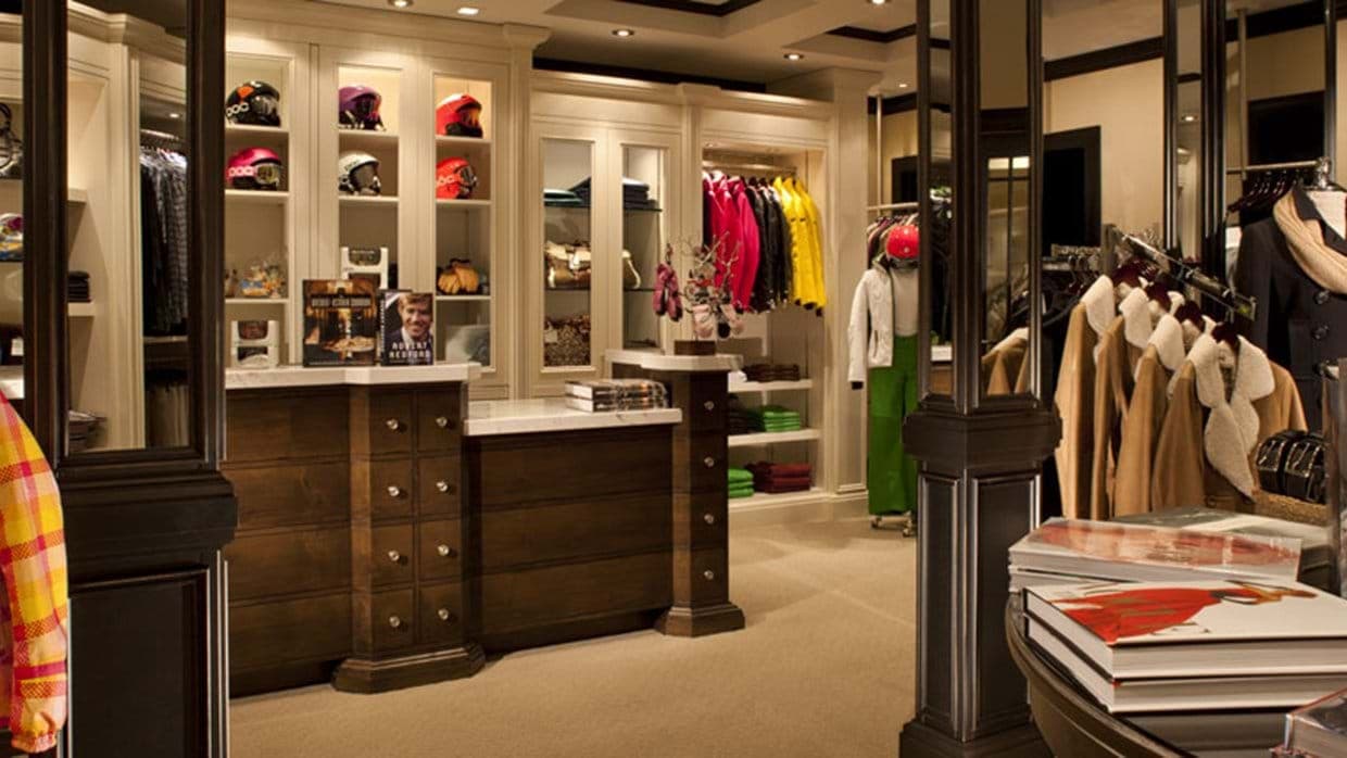 Walk-in closet with custom cabinetry and integrated ski gear storage