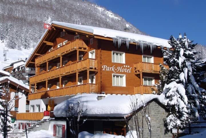 Chalet exterior with private balconies and ski lift access nearby