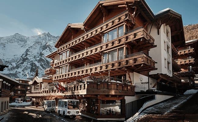 Ski-in/ski-out chalet with private balconies and mountain peak views