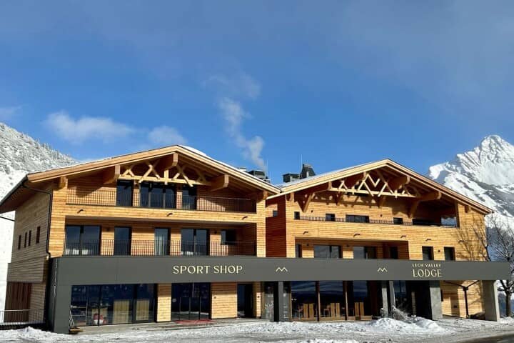 Lodge exterior with on-site sport shop and private guest balconies