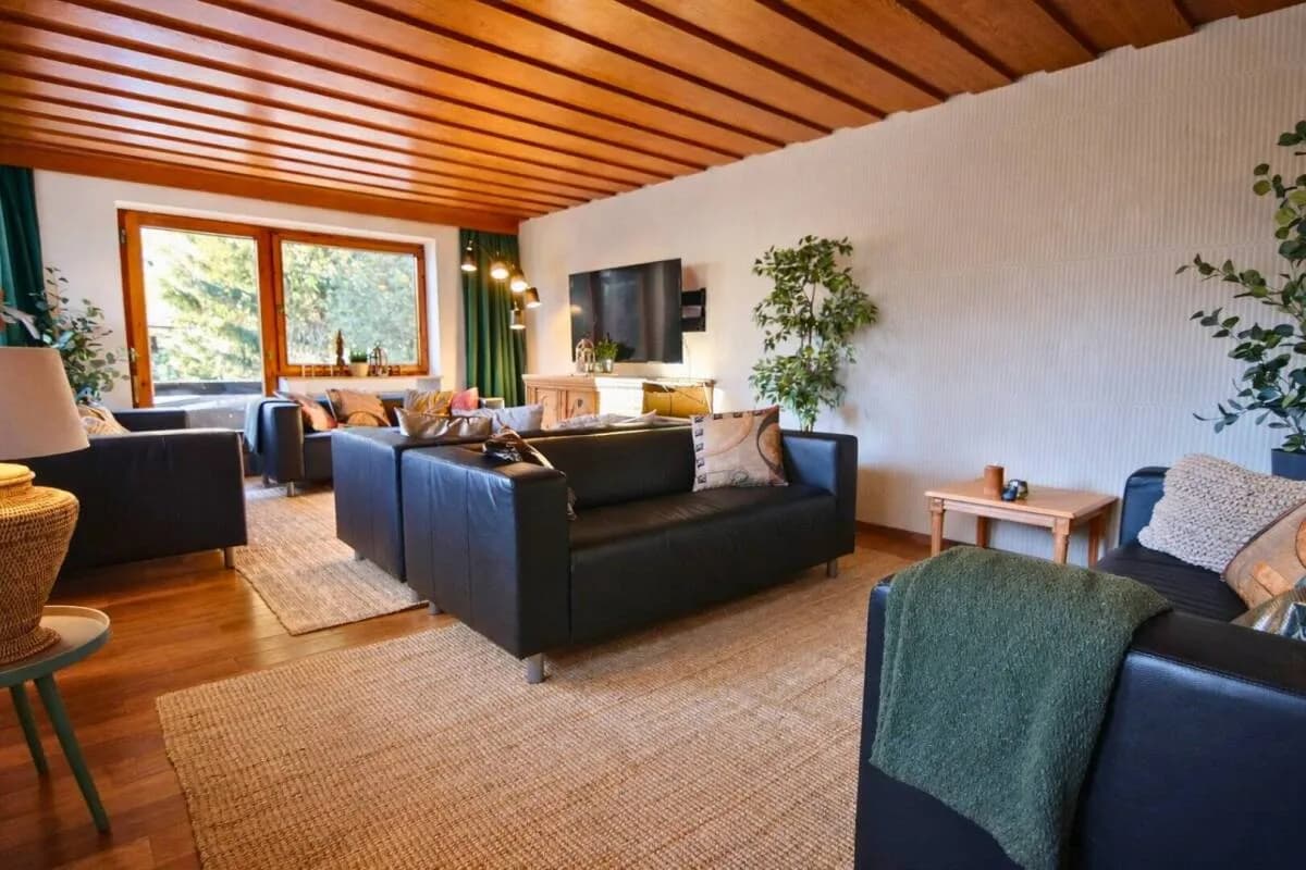 Television lounge seating beside the windows