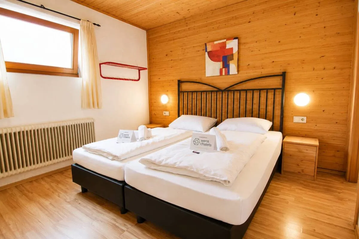 Wood-panelled guest bedroom