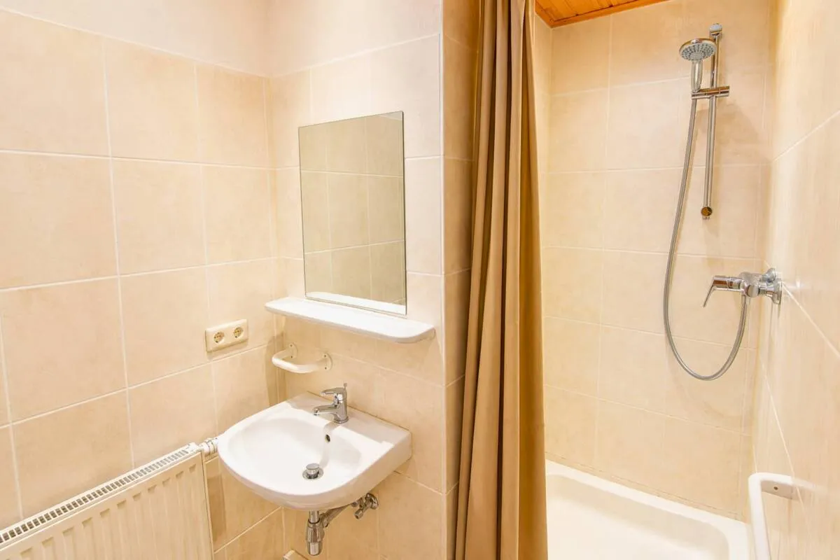 Guest shower room with tiled walls