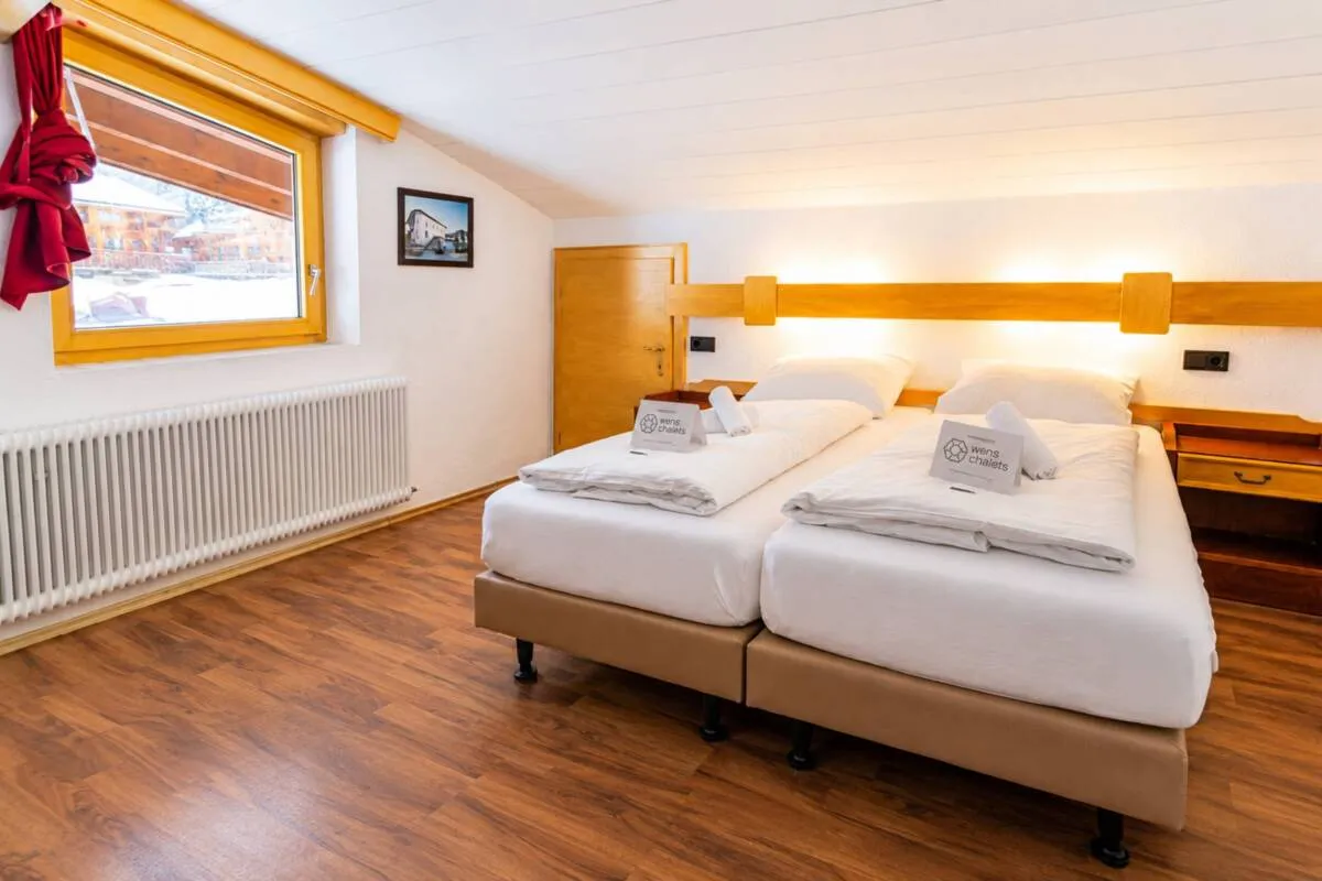 Guest bedroom with two adjacent single beds