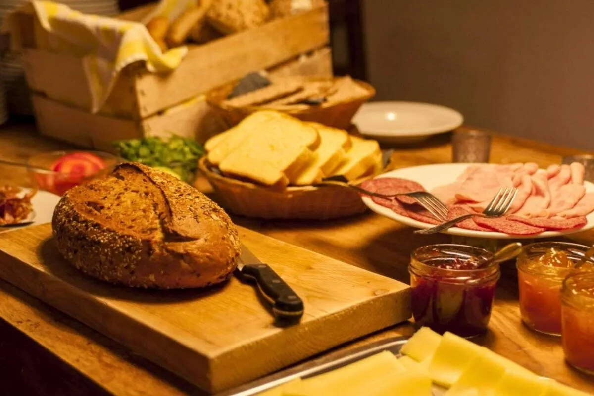 Breakfast buffet with bread, cheese and cold meats