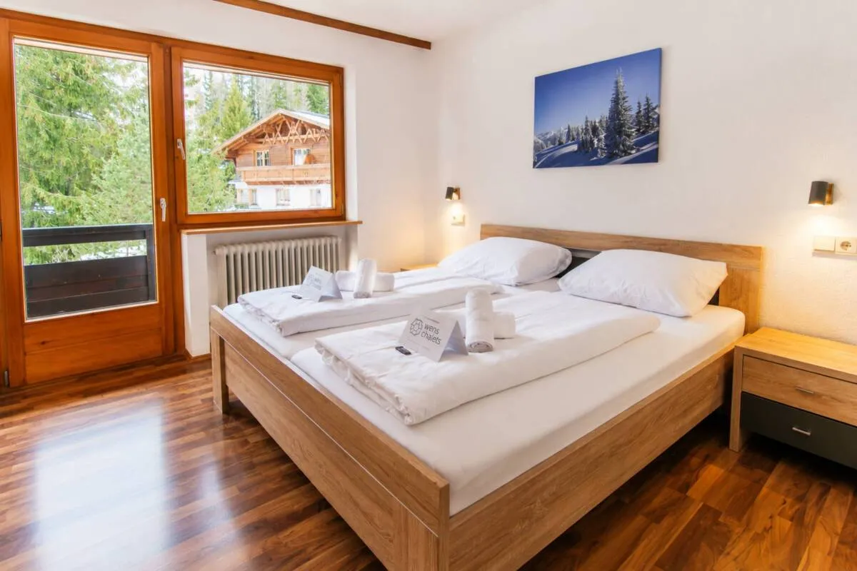 Guest bedroom with a balcony door