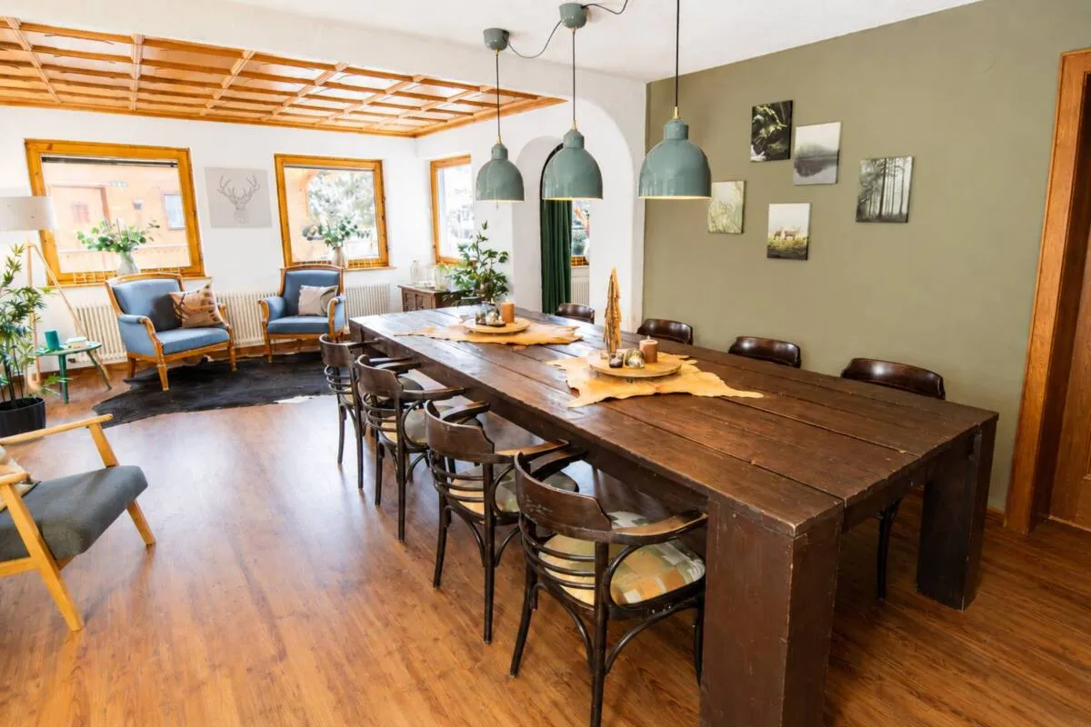 Shared dining tables beside the windows