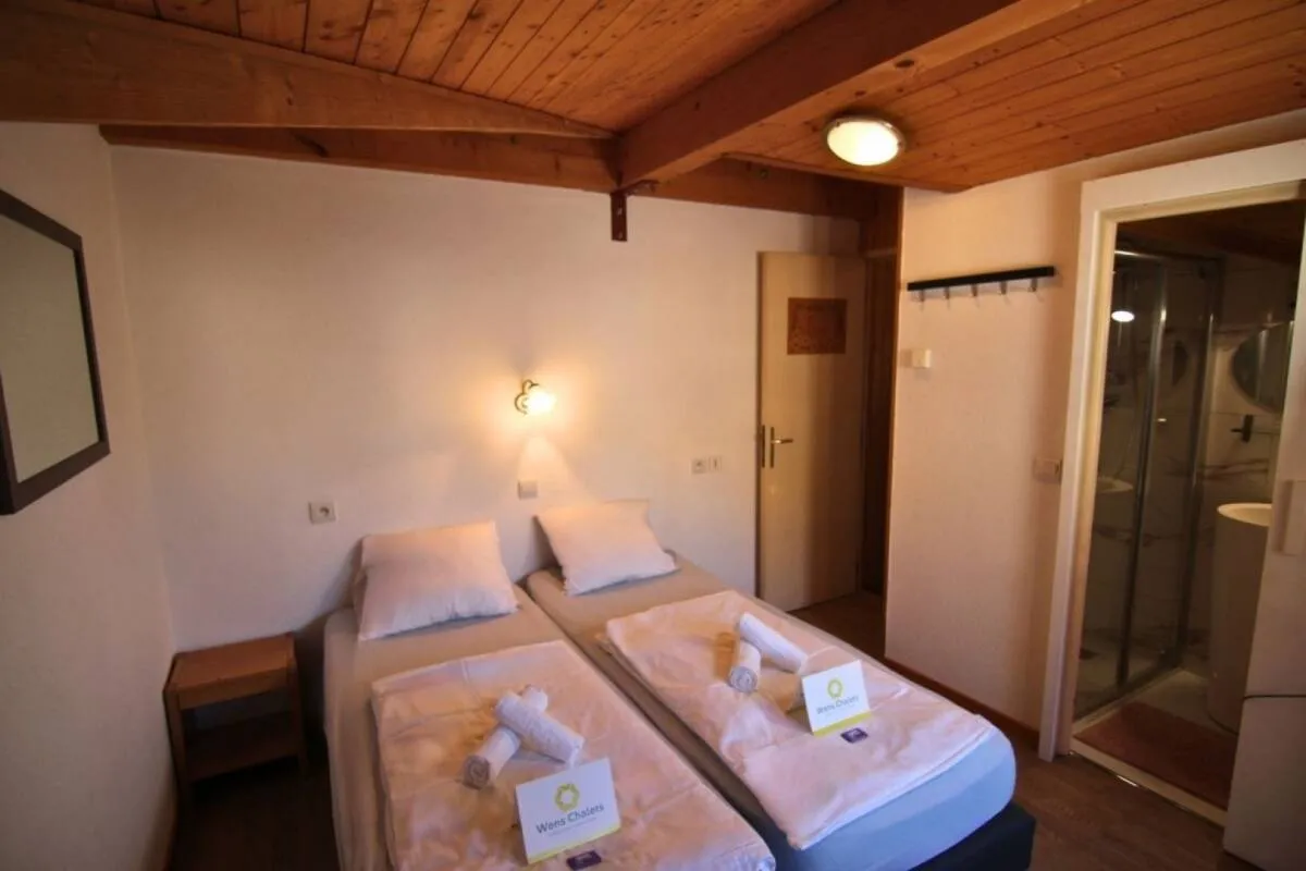 Guest bedroom with two adjacent single beds