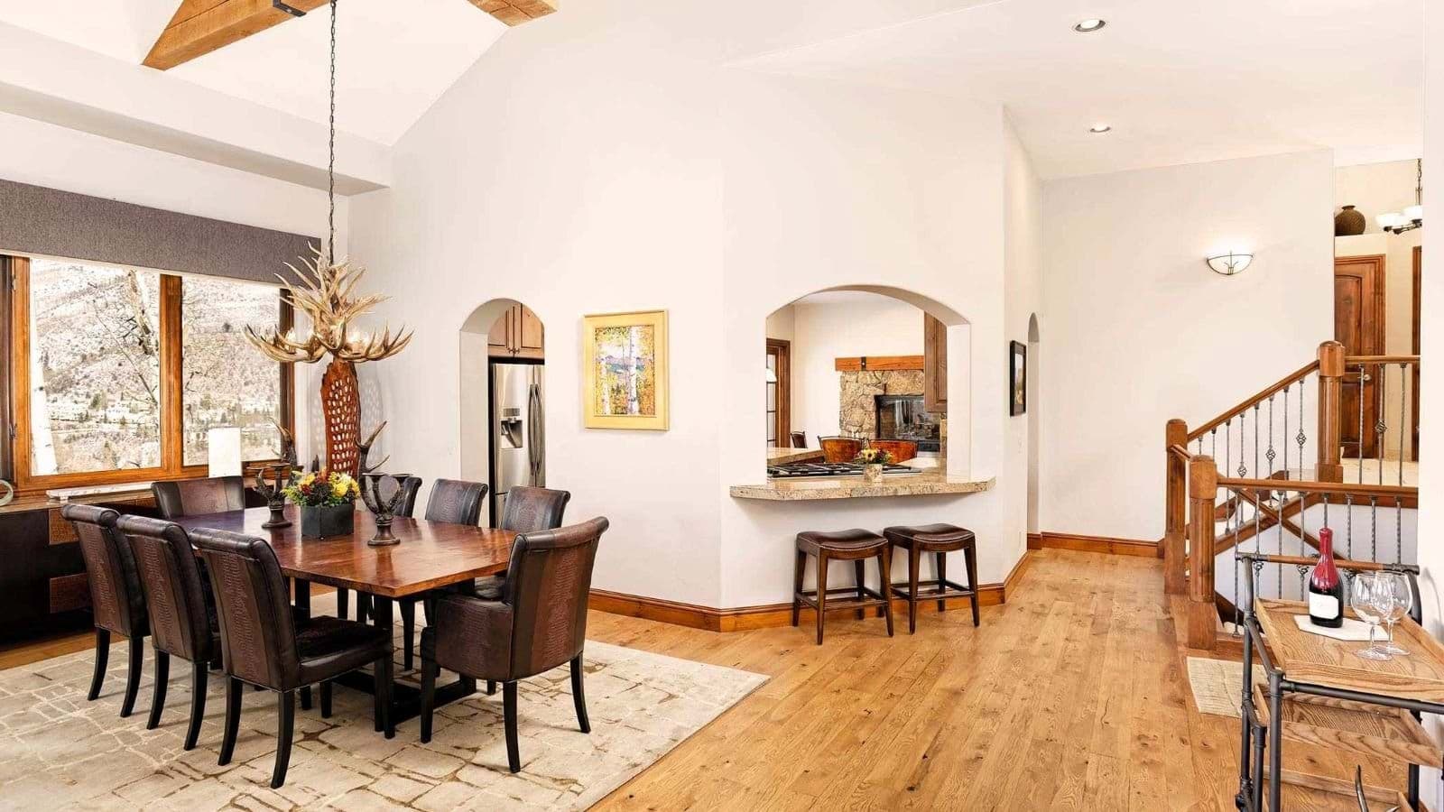 Dining area seats 8; kitchen pass-through with breakfast bar seating