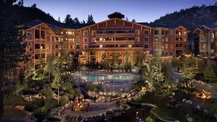 Resort exterior with heated pool and communal fire pits