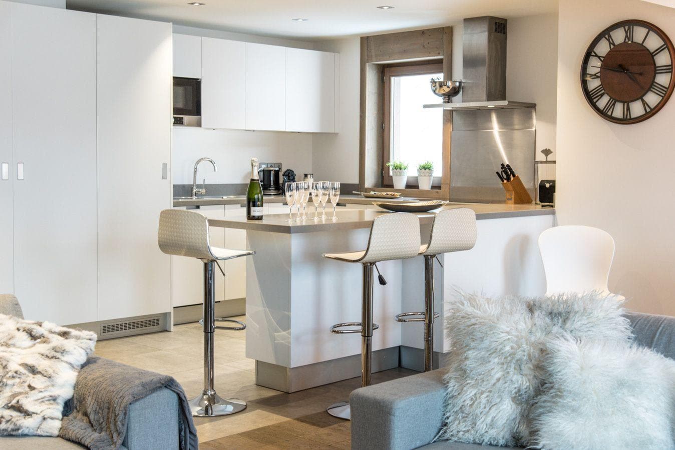 Kitchen island with breakfast bar seating for 3 and built-in microwave