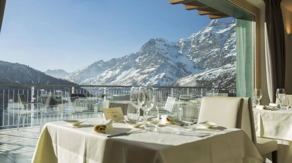 Dining area with panoramic mountain views and outdoor terrace access
