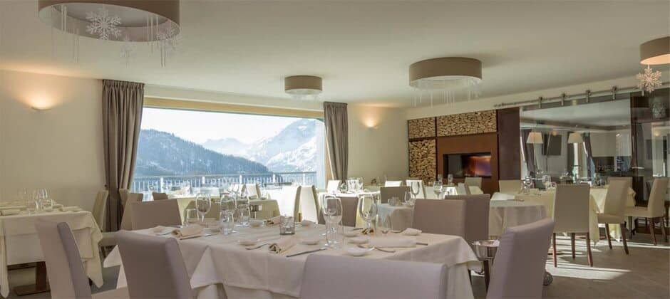 Dining room with wood-burning fireplace and panoramic mountain views