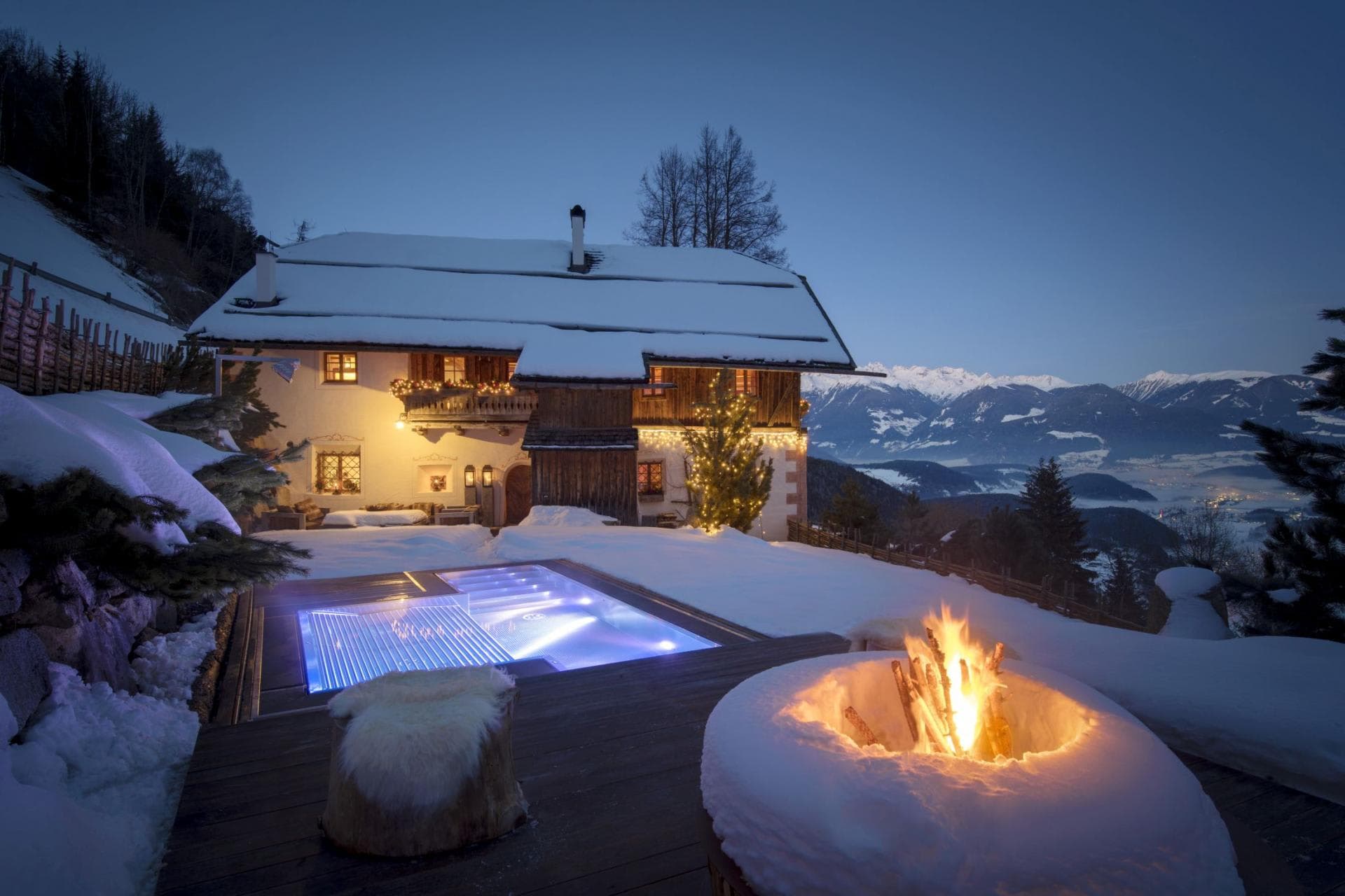Heated outdoor pool and fire pit with panoramic mountain views