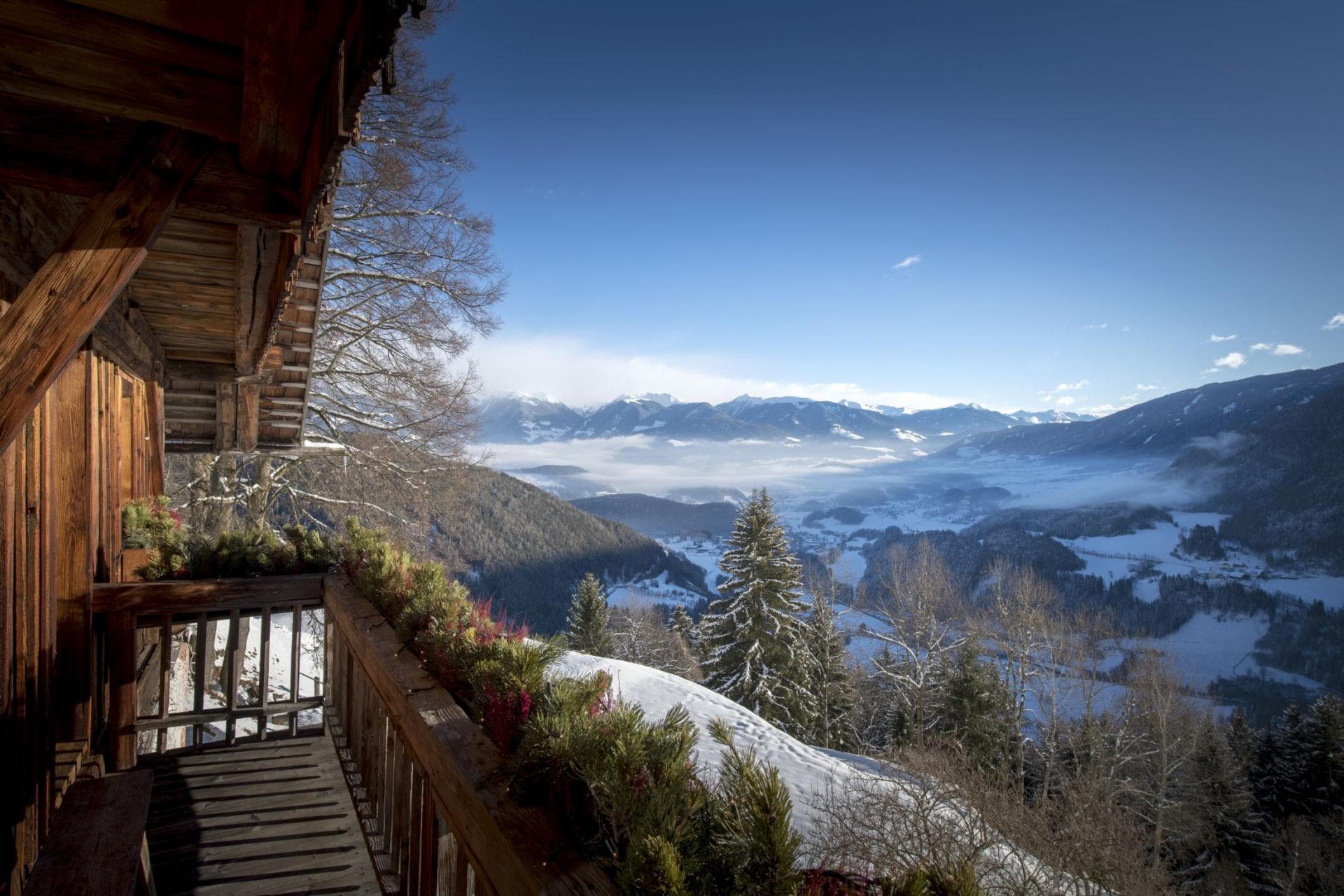 Private balcony with panoramic views of snow-covered mountain valley