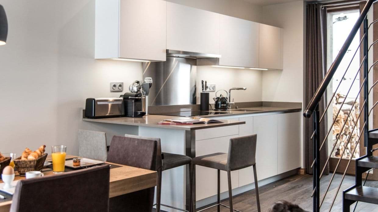 Kitchen with Nespresso machine and breakfast bar seating for two