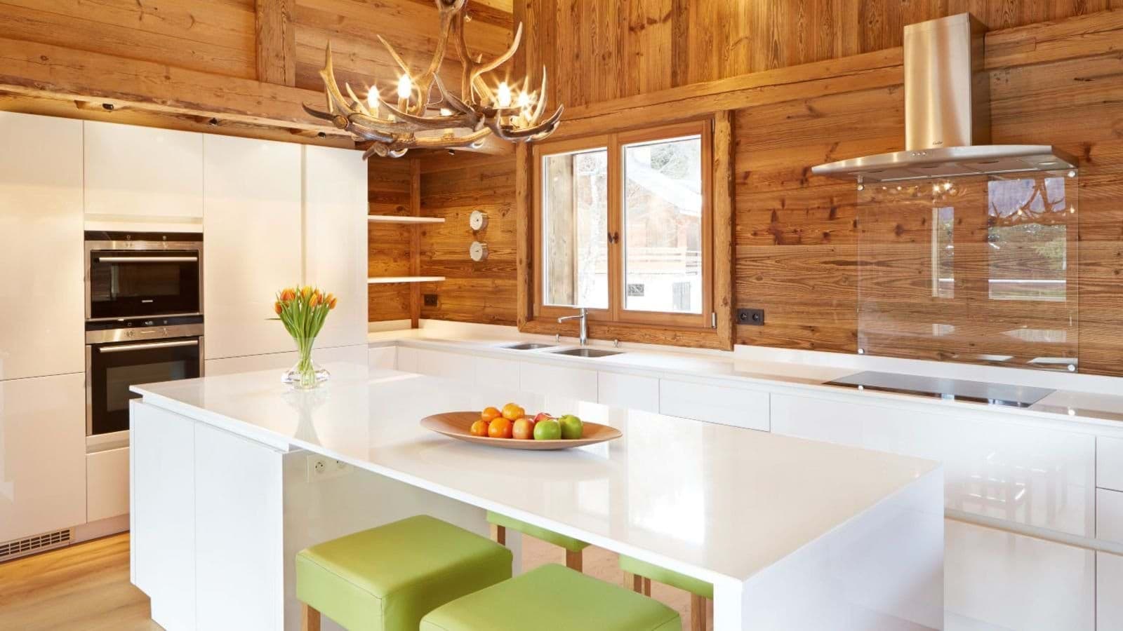 Kitchen with waterfall island, induction cooktop, and double wall ovens