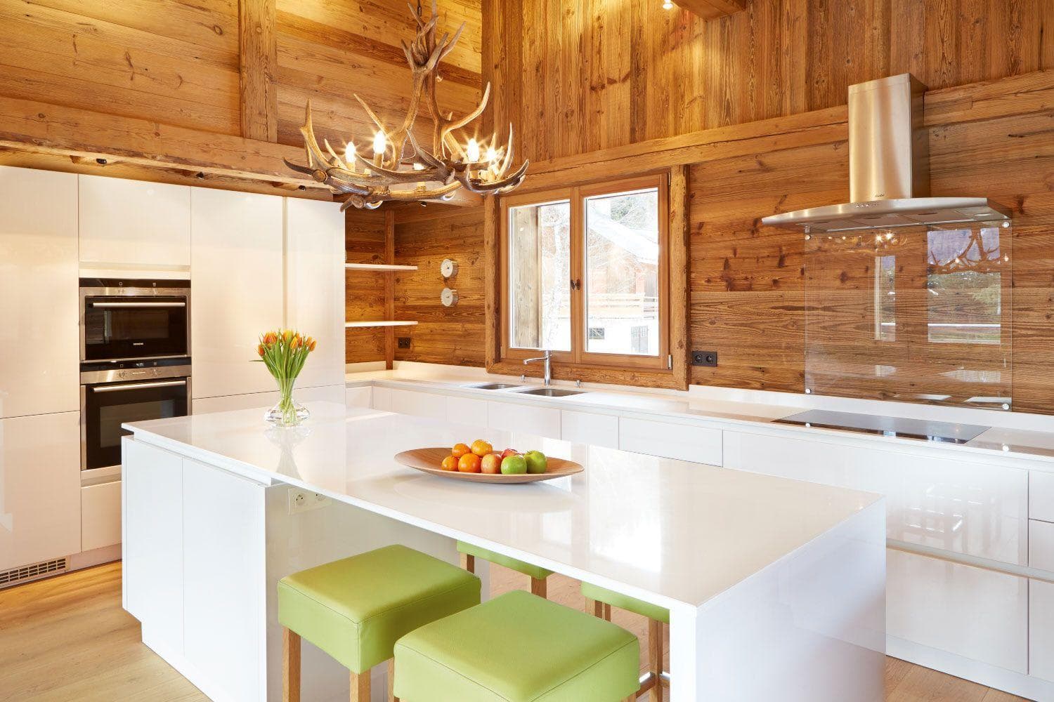 Kitchen with island seating and double wall oven