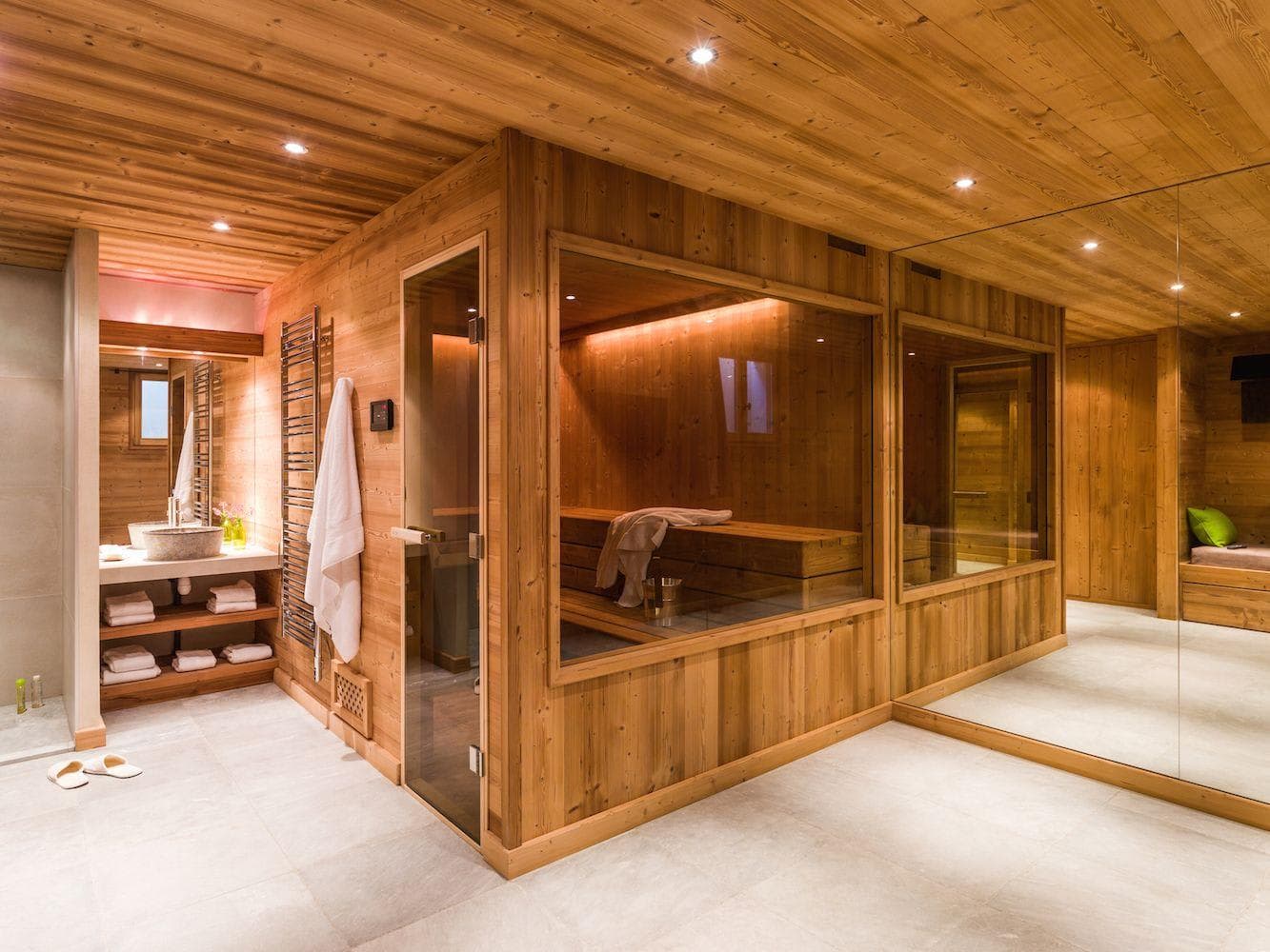 Wood sauna with large glass window and tiered bench seating