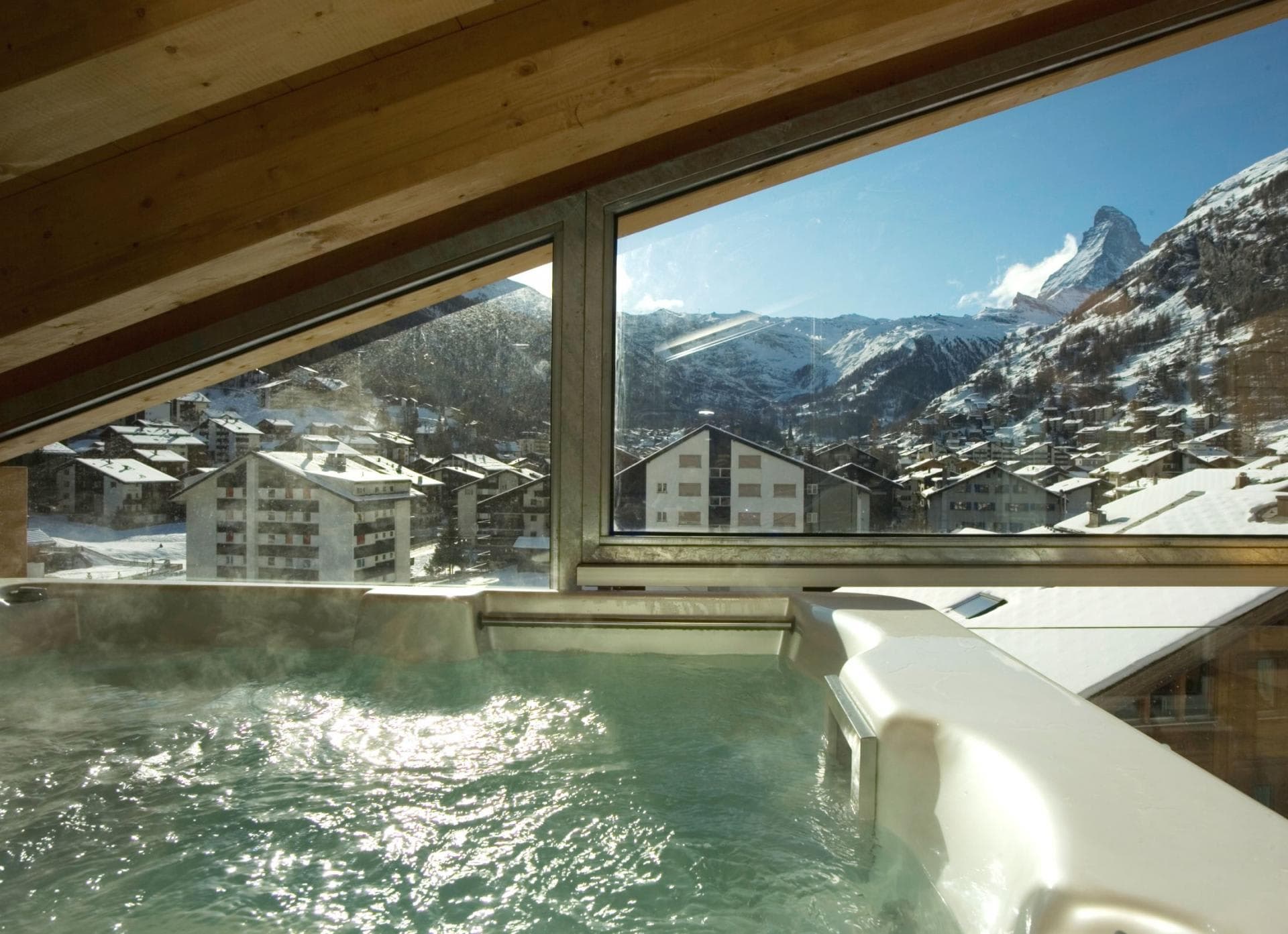 Indoor hot tub with Zermatt village and Matterhorn views
