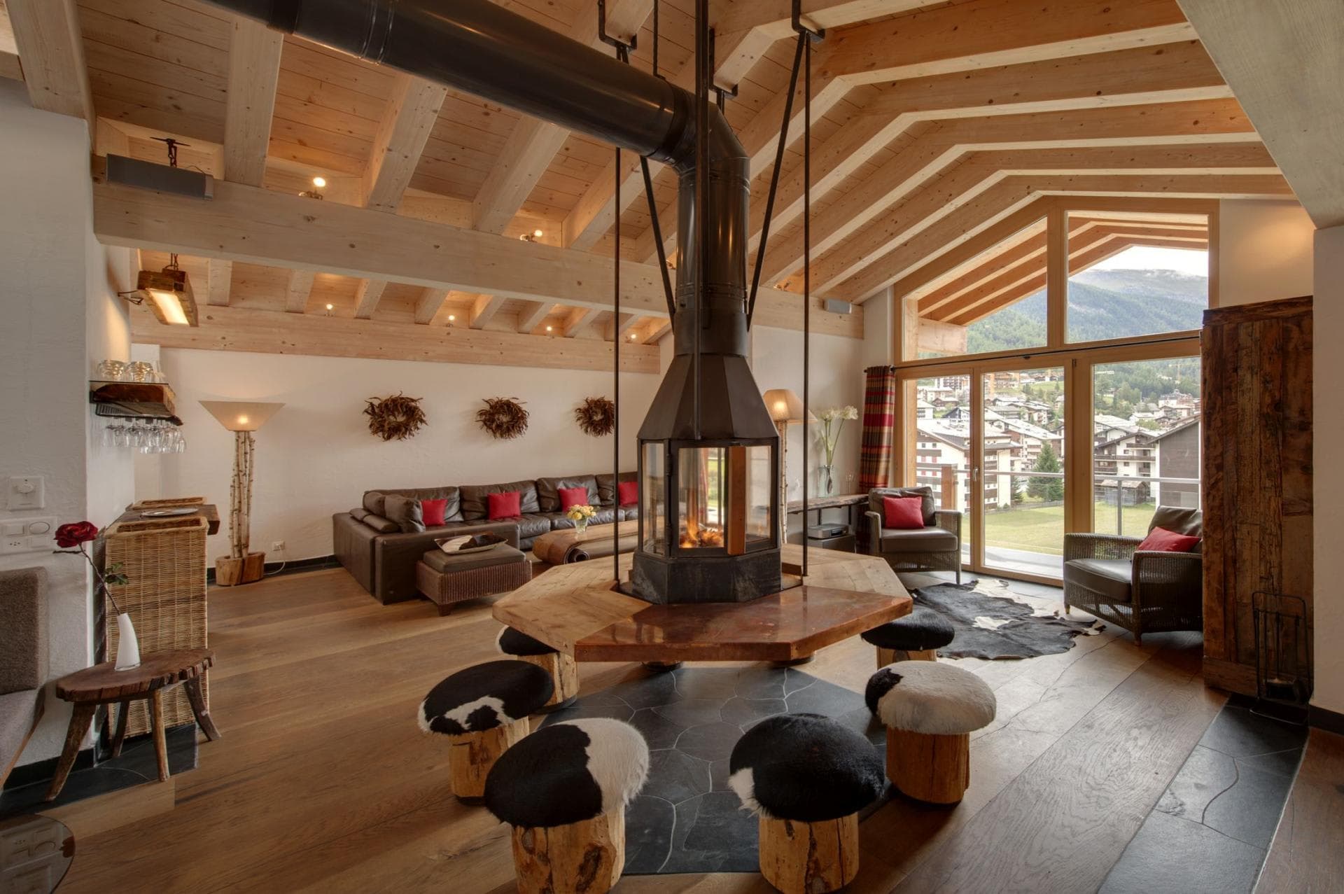 Central fireplace with 360-degree bench seating and mountain views