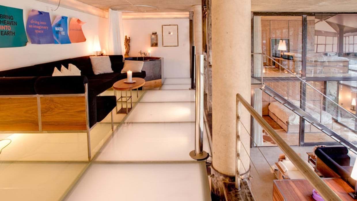 Mezzanine lounge featuring translucent glass floor and views of lower levels