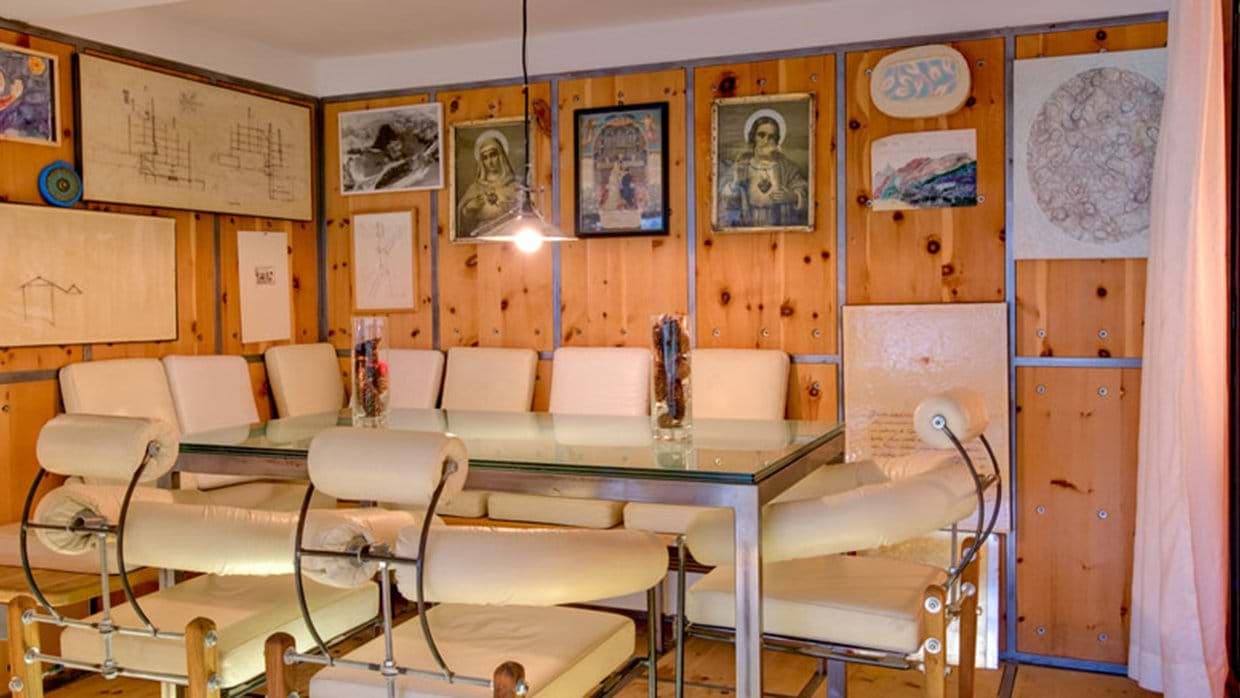 Dining area with glass-top table and seating for 10 guests