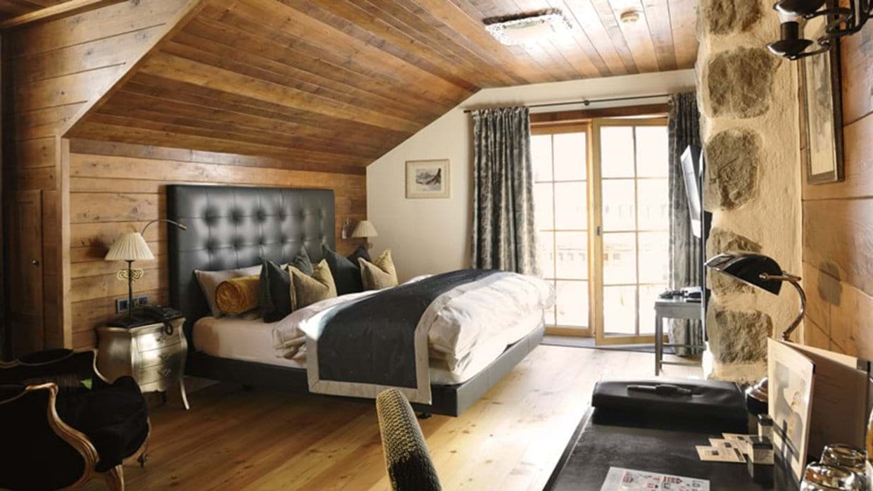 Bedroom with king bed and private balcony access