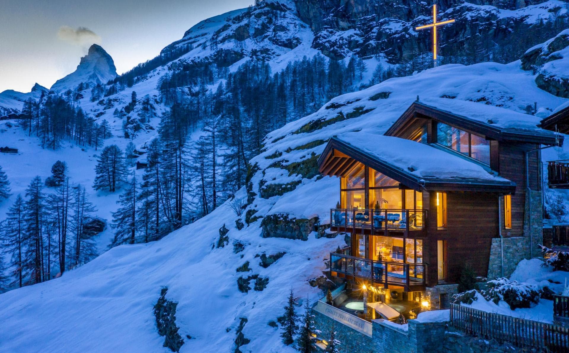 Chalet exterior featuring Matterhorn views and private outdoor hot tub