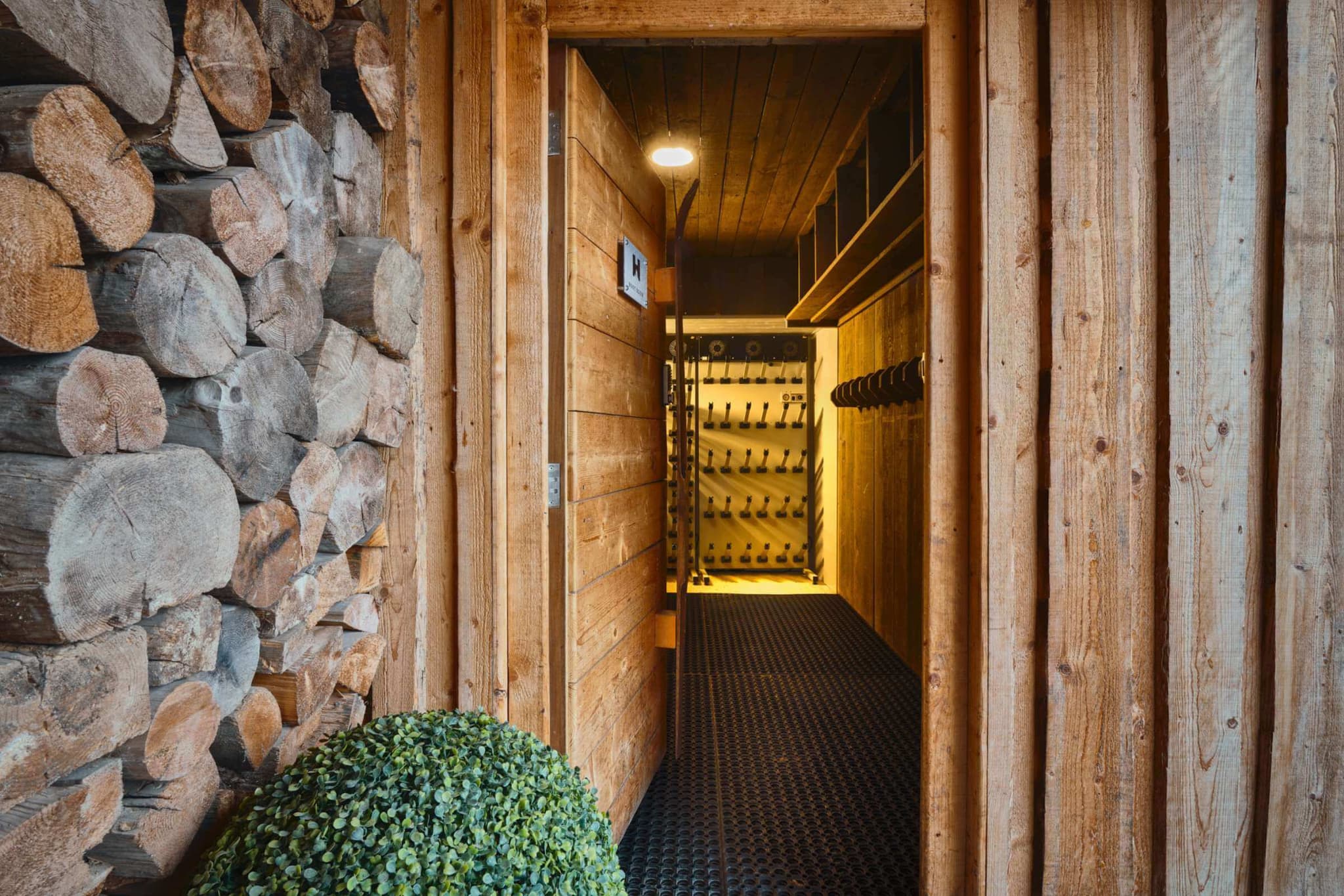 Shared ski and boot room with heated storage racks