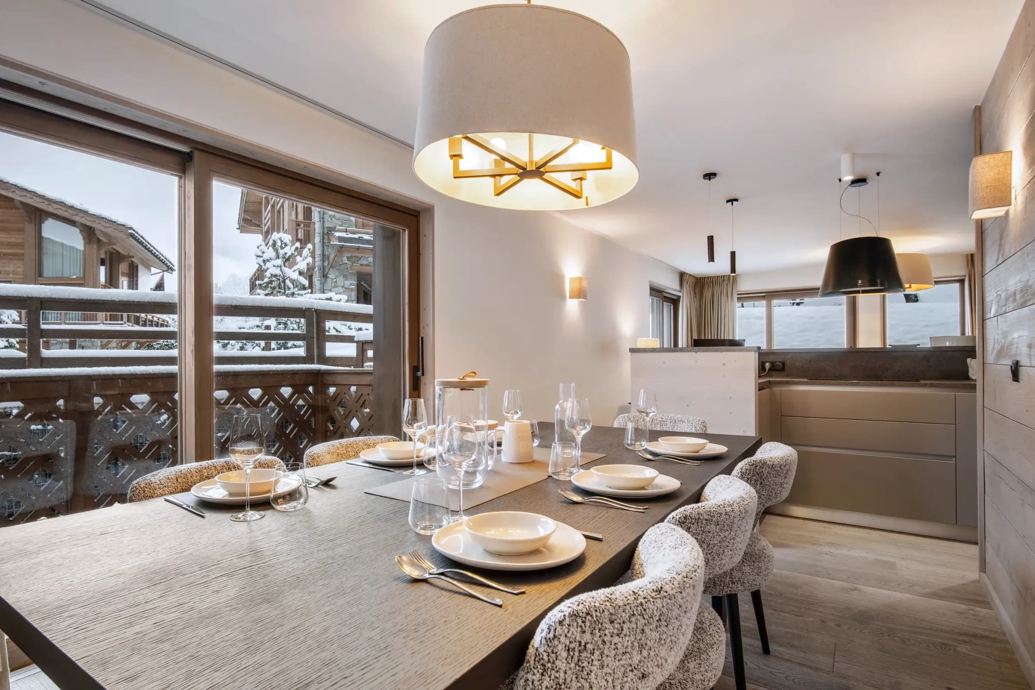 Dining area with six upholstered chairs and balcony doors, open to the kitchen