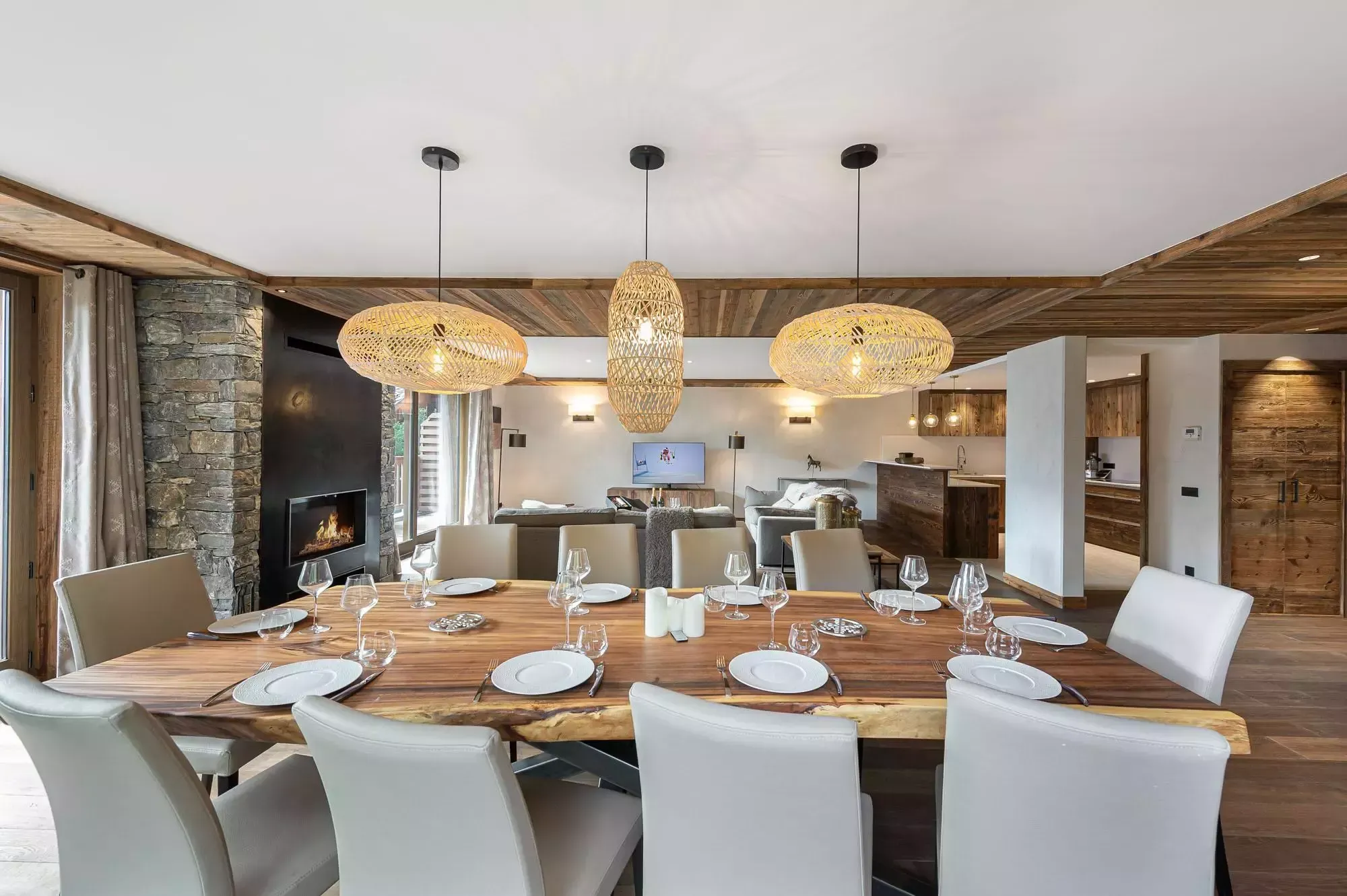 Dining table for ten beside the stone fireplace