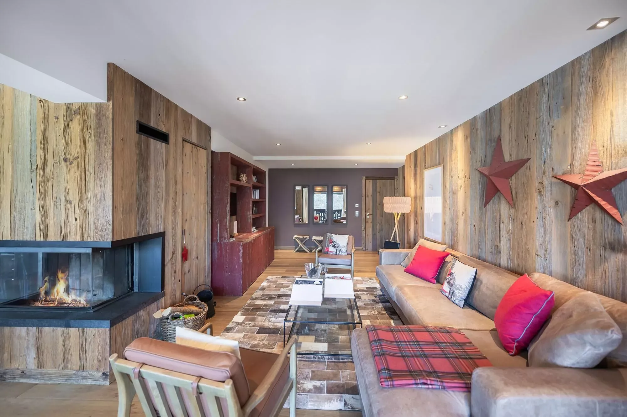 Living room with fireplace and dining area beyond