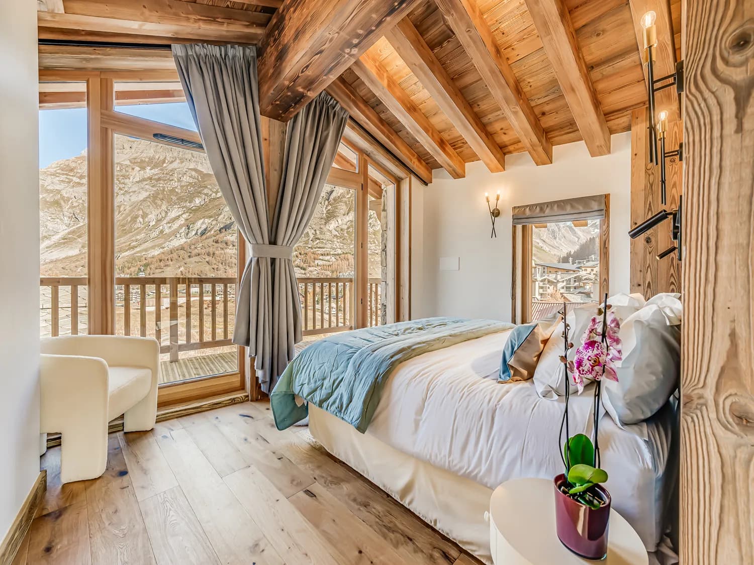 Primary bedroom with mountain-facing balcony doors