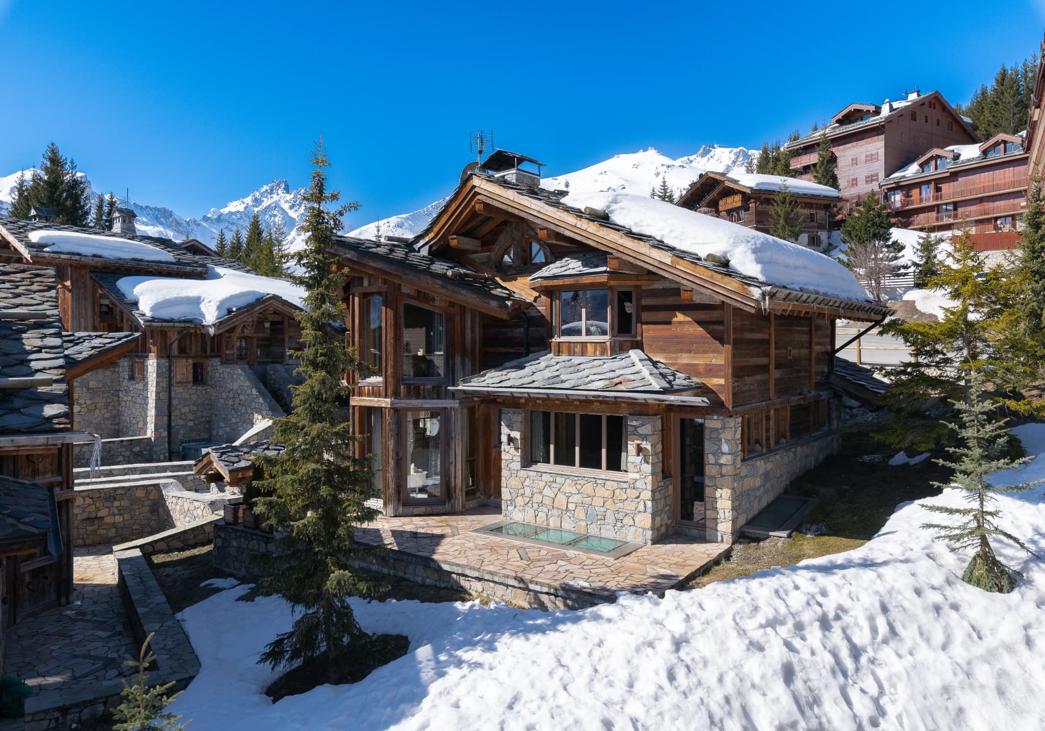 Snow-covered timber chalet in a mountain hamlet