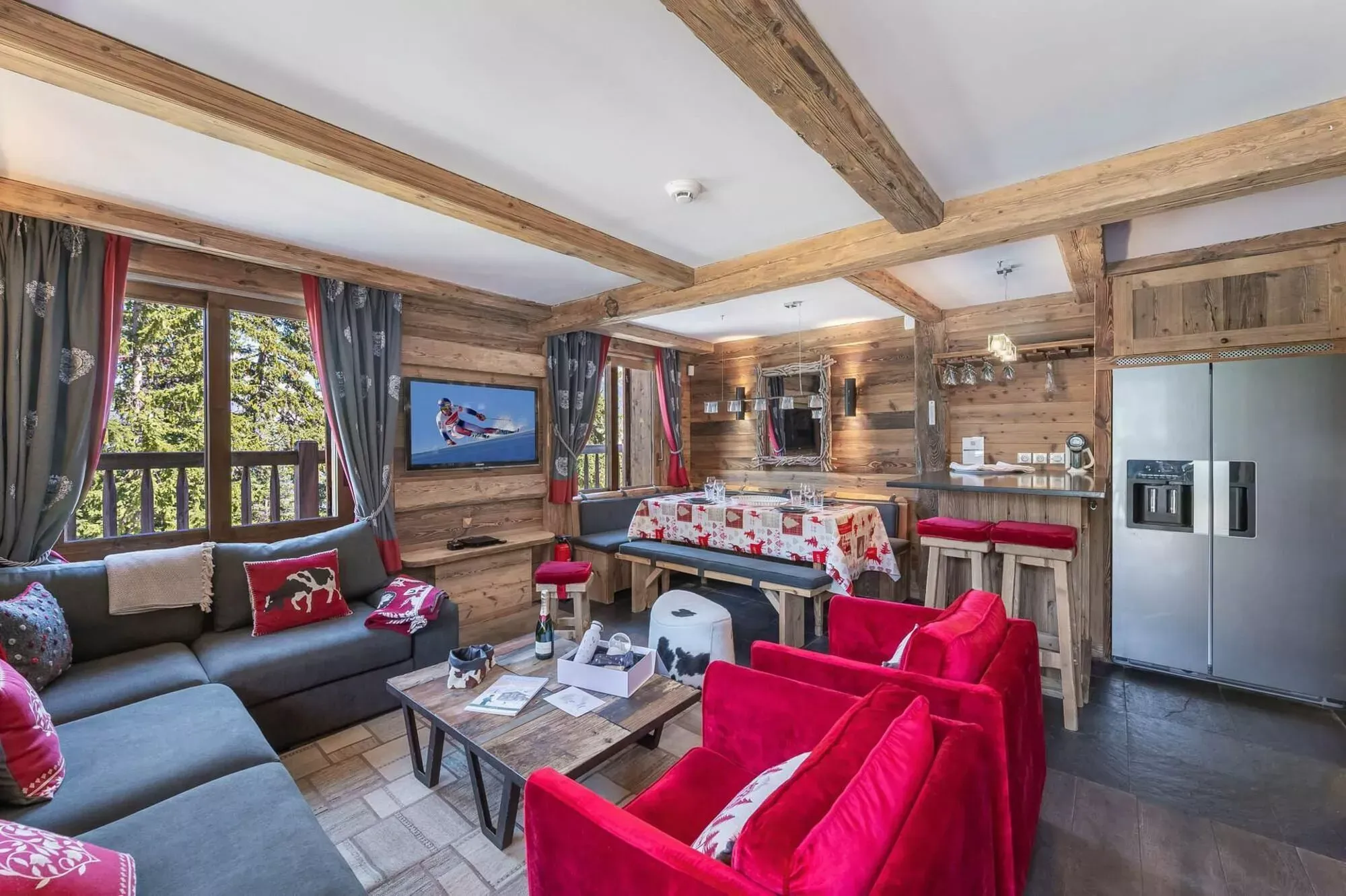 Living and dining area with bench seating and an open kitchen