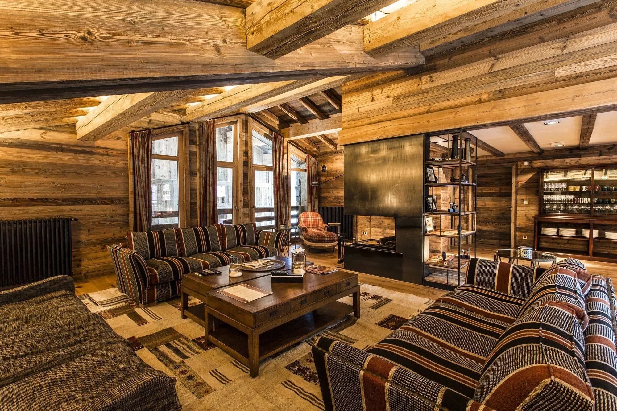 Lounge seating beside the wood fireplace and old-village windows