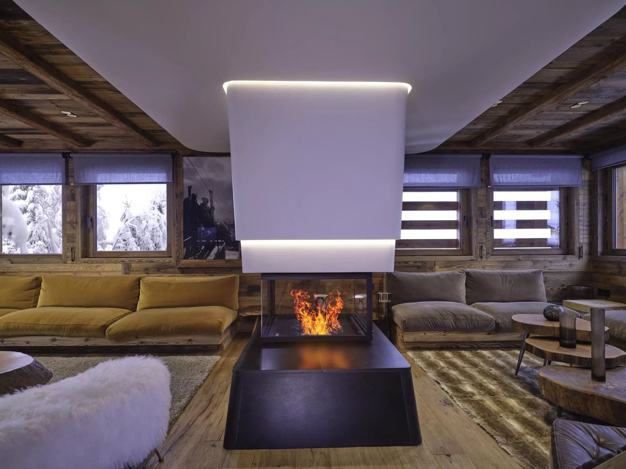 Central fireplace between two chalet lounge areas