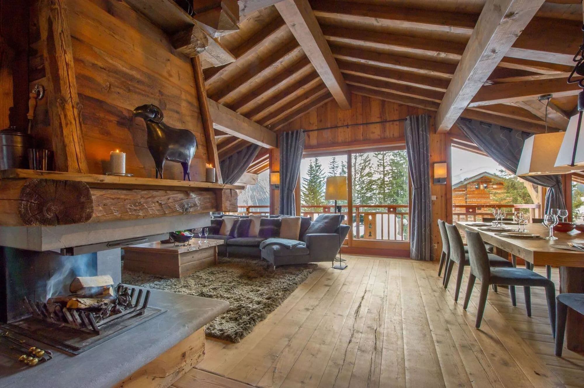 Central wood fireplace separating the lounge and dining area