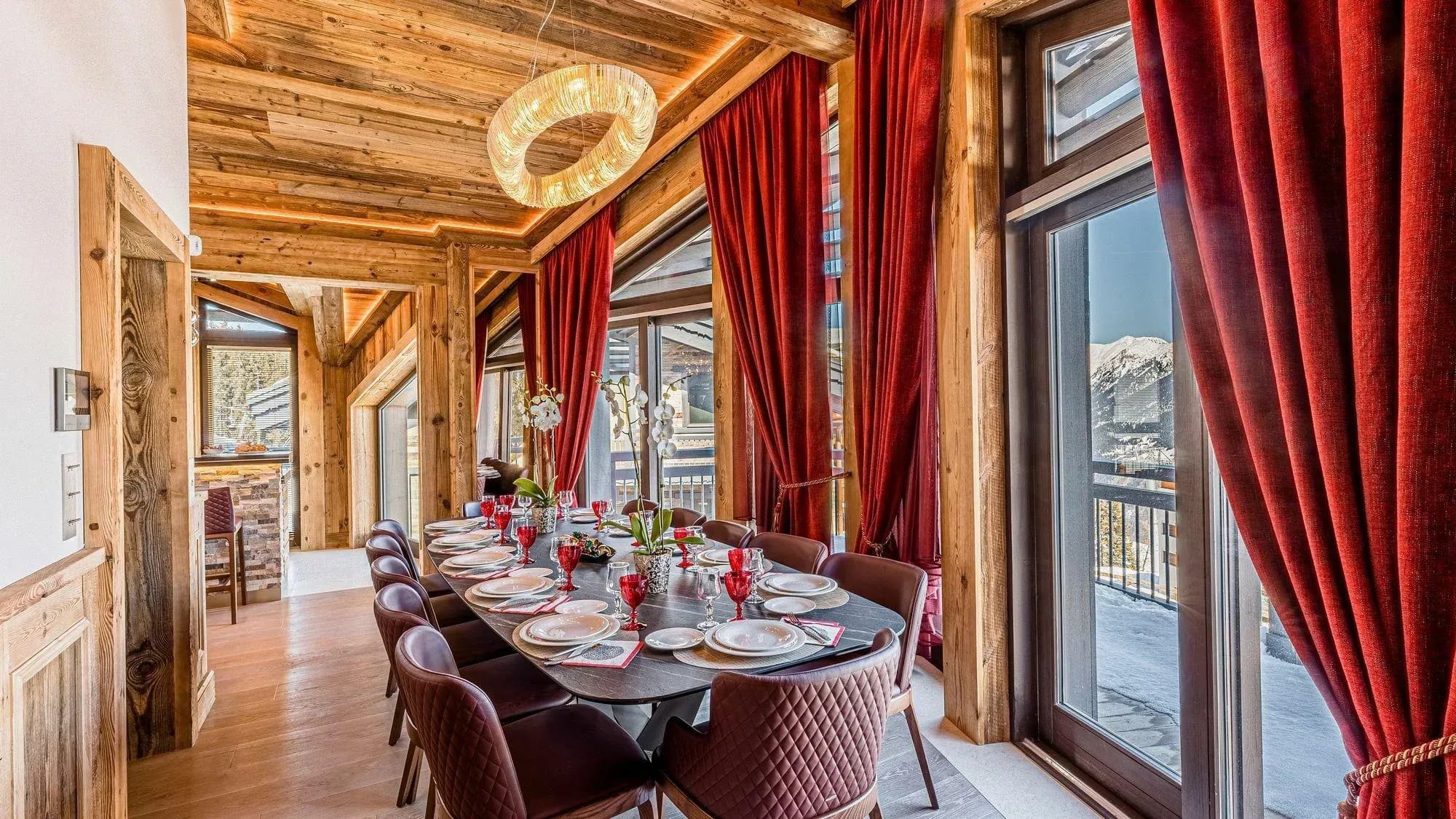 Dining room seats 8; snow-capped mountain views through floor-to-ceiling windows