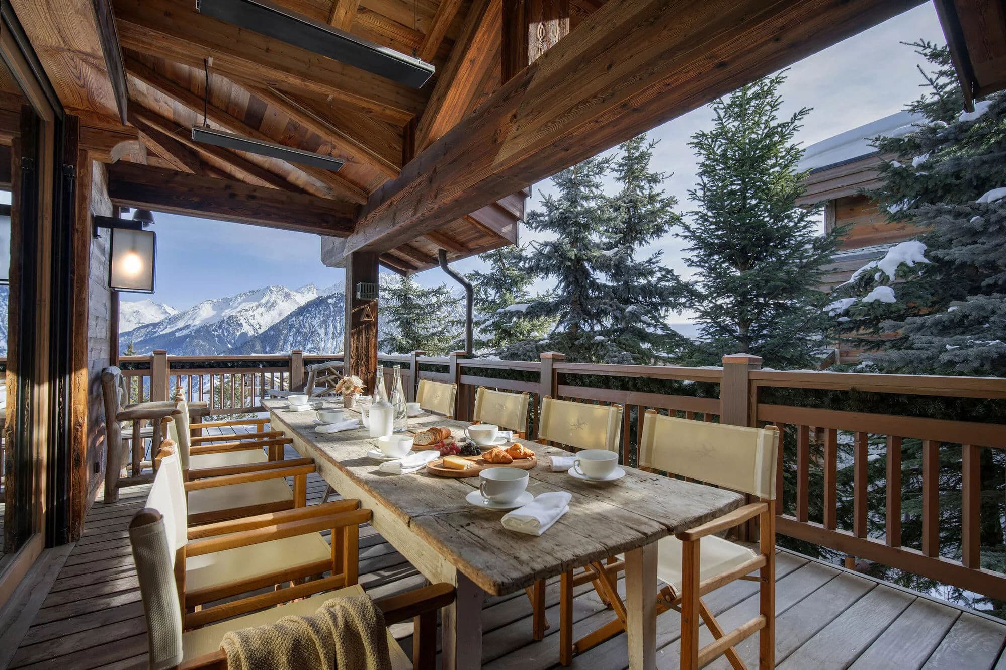 Covered terrace dining area with panoramic valley views