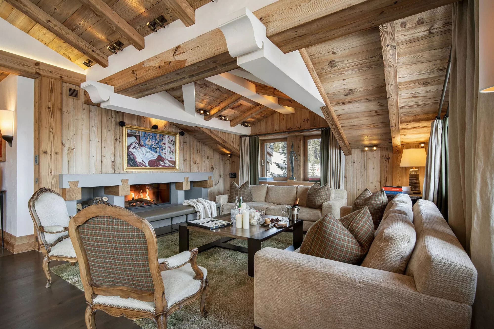 Living room with timber beams and wood fireplace