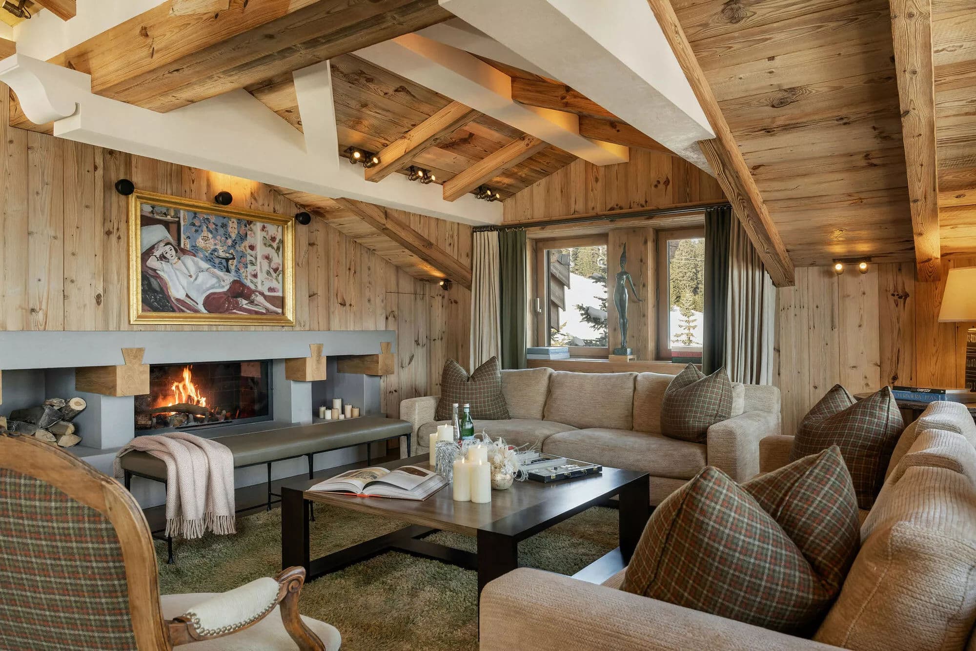 Wood fireplace and lounge seating in the living room