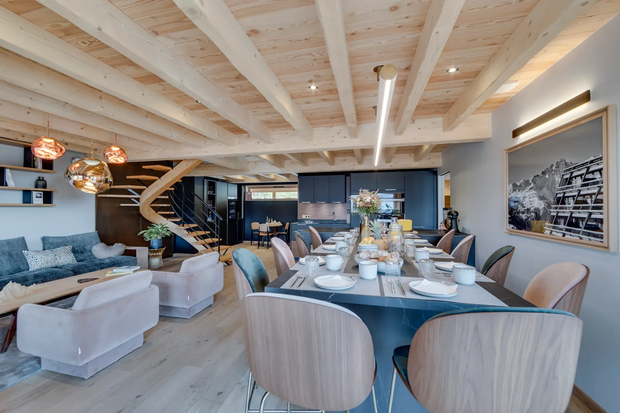 Dining table with ten chairs, open to lounge and staircase