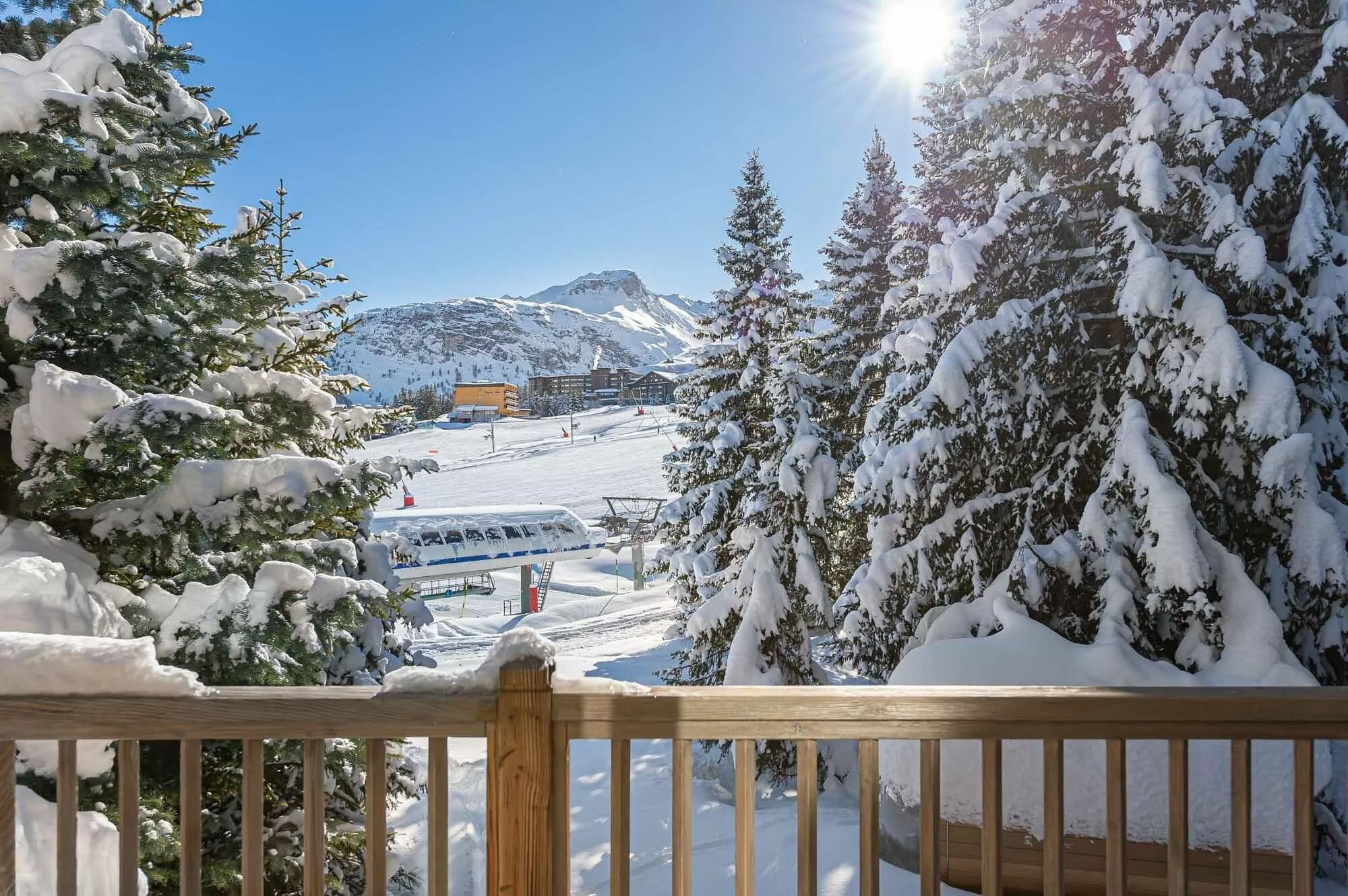 Balcony view across the Pralong piste and surrounding snowy mountains