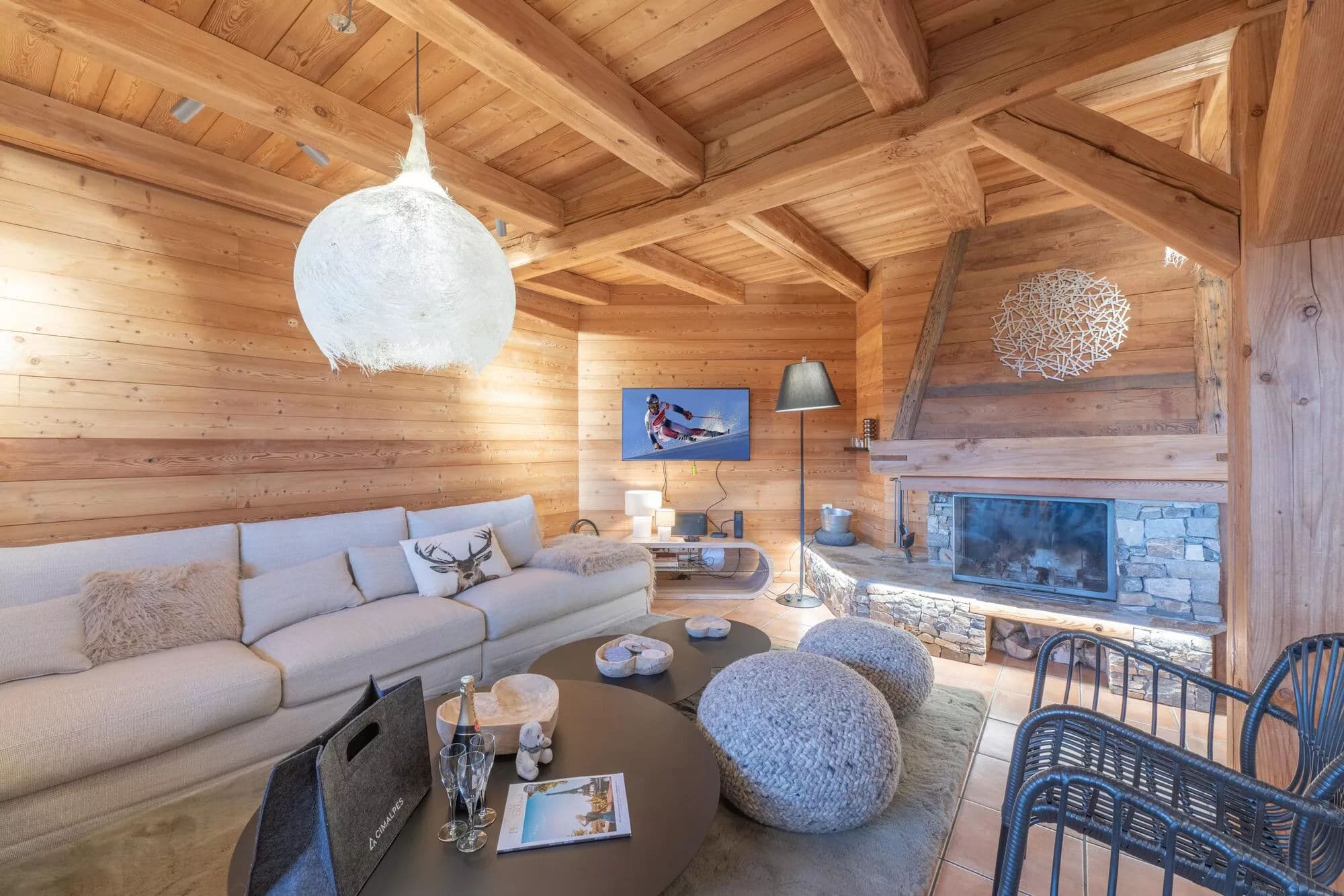 Living room with fireplace and chalet-style timber interior