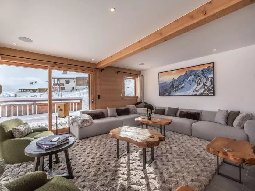 Television lounge with sectional seating and timber finishes