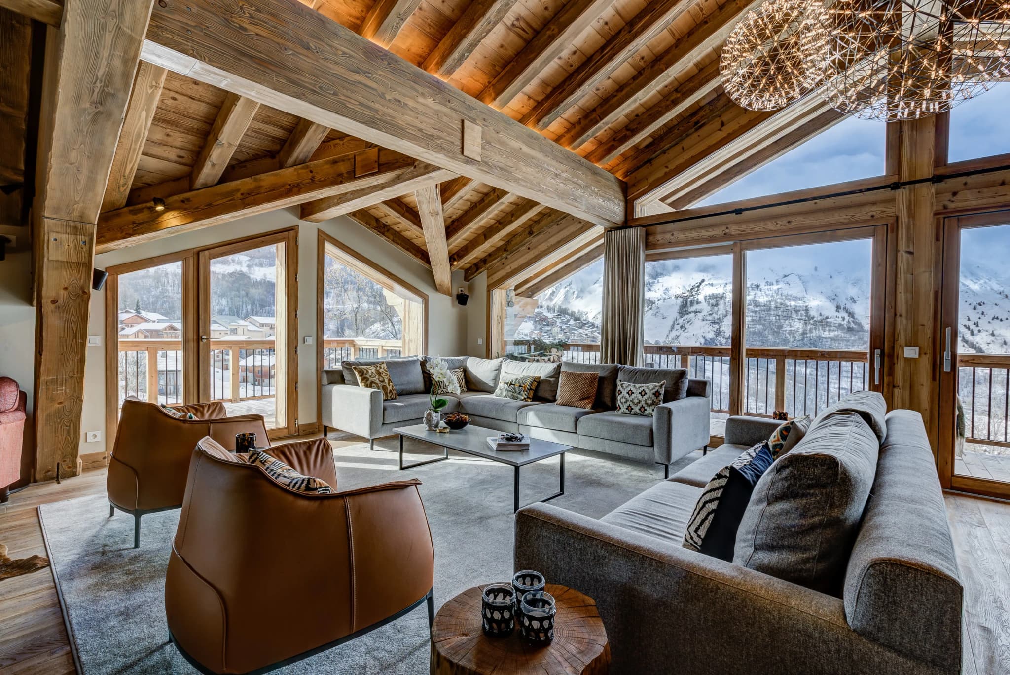 Living room with tall windows and mountain views