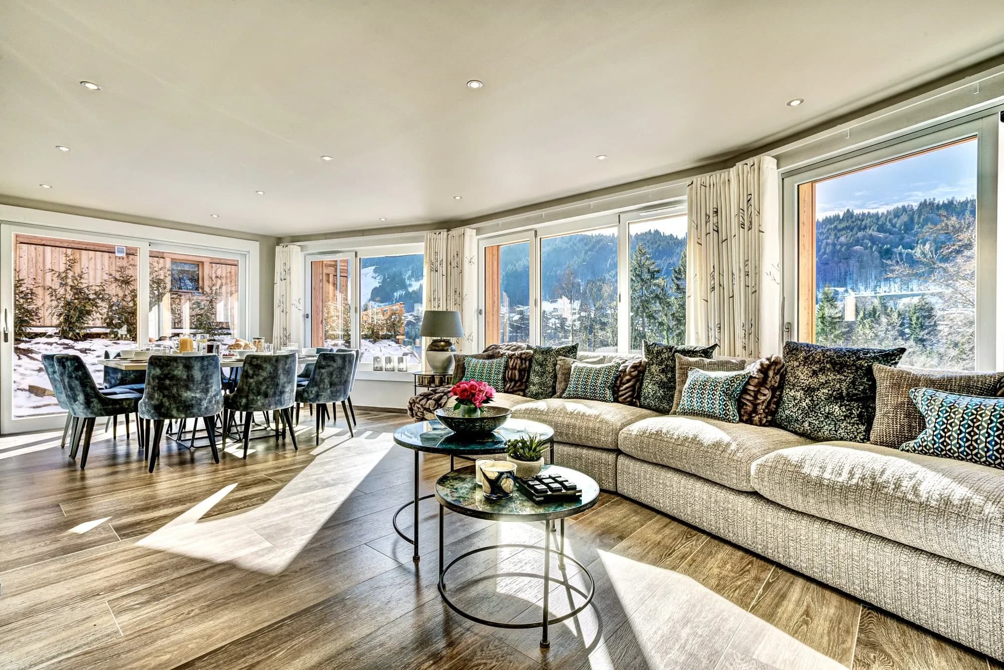 Open-plan living and dining room with mountain views