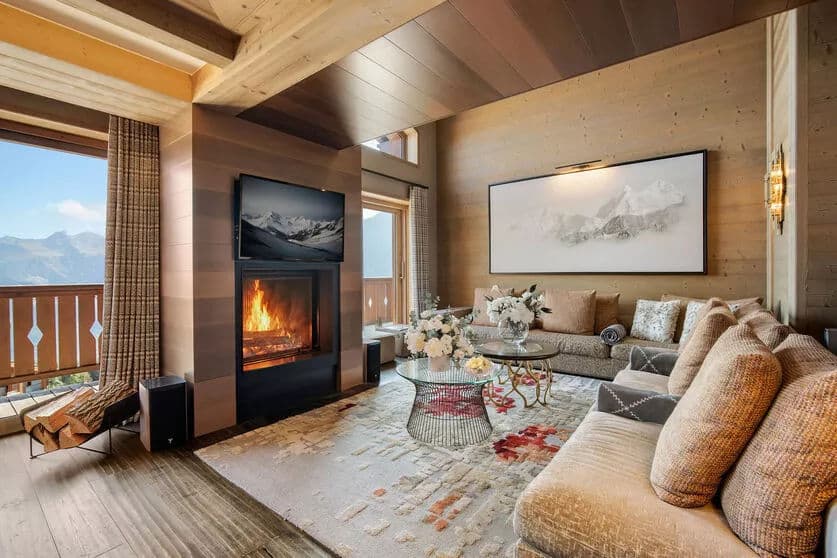 Living room with a wood fireplace and dining area